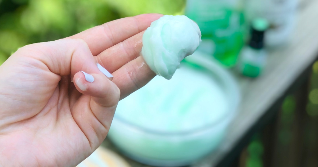 DIY whipped sunburn cooling lotion on fingers 
