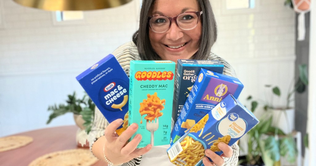 woman holding 5 boxes of mac and cheese