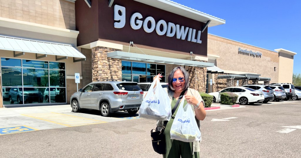 woman in front of goodwill thrift store