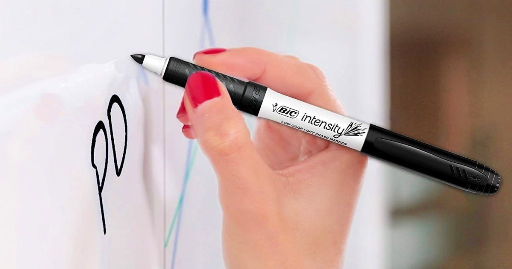 woman using a BIC Intensity dry erase marker on whiteboard 