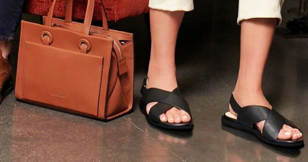 woman wearing cole haan sandals with handbag