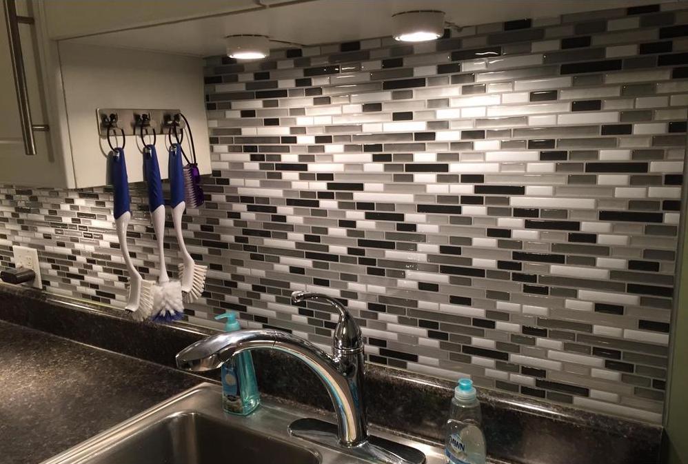 black white and gray backsplash on wall in kitchen