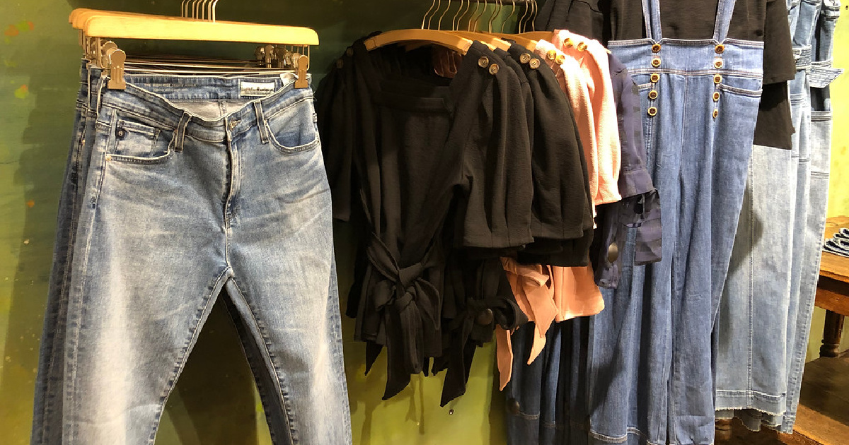 jeans shirts and more clothing on display in store