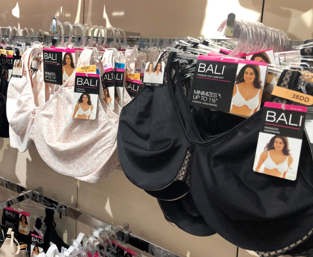 black and nude colored bali bras on hangers on store display