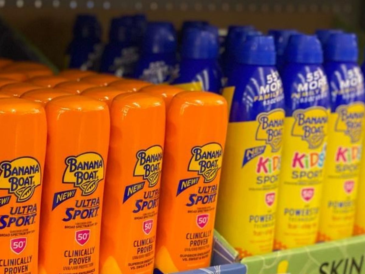 sunscreen bottles and sprays on a store display