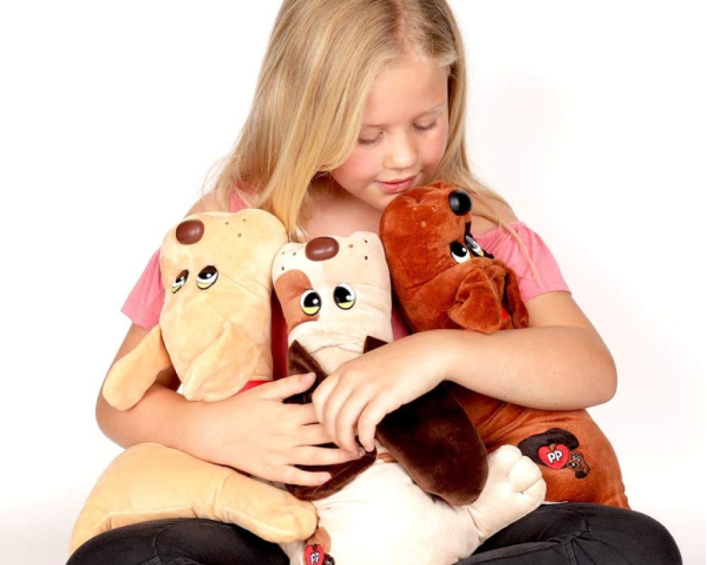 pound puppies toys girl holding them