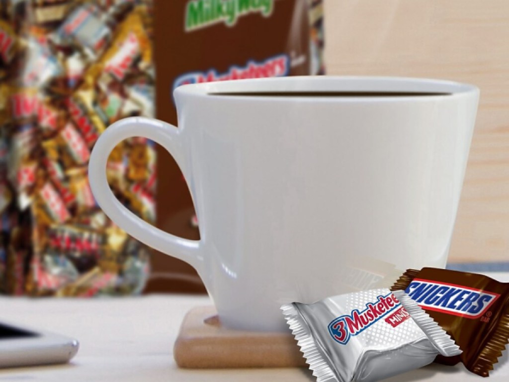 snickers milky way chocolate next to coffee cup