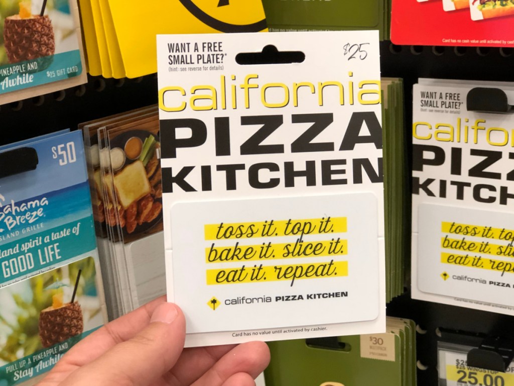 hand holding $25 California Pizza Kitchen gift cad