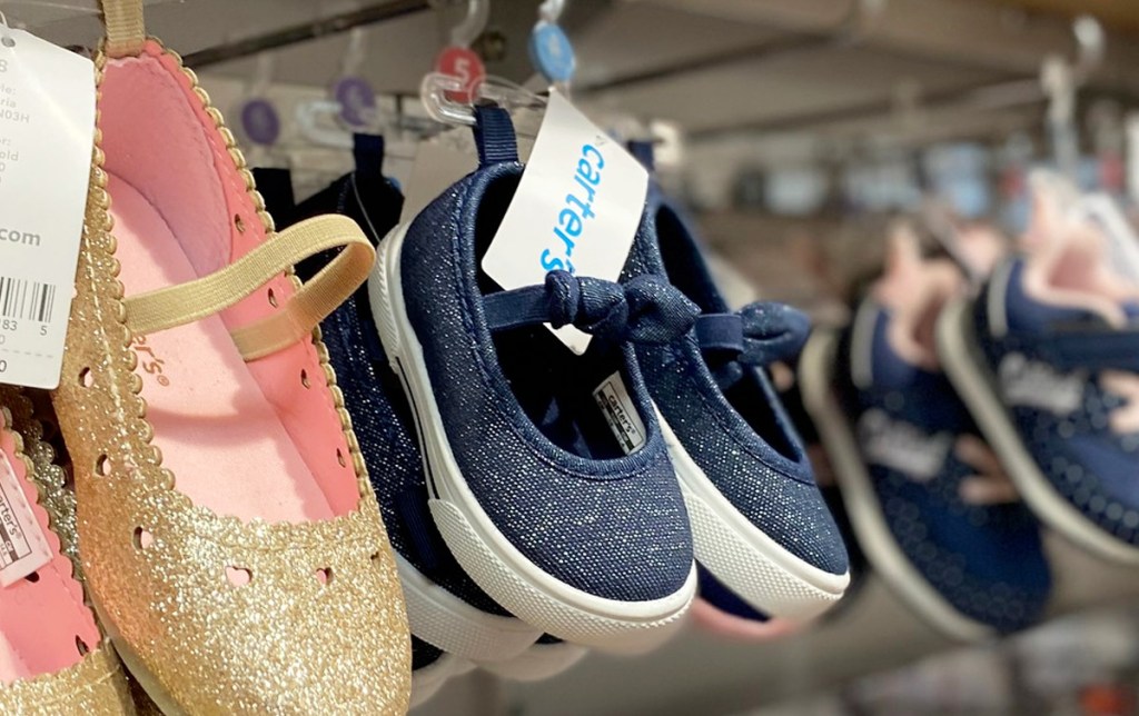 navy blue sparkly girls mary jane shoe with elastic strap on Carter's store display racks