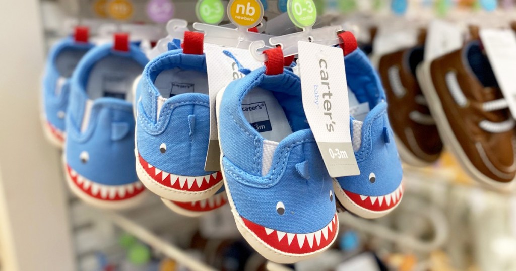 toddler boys blue shark shoes on Carter's display rack