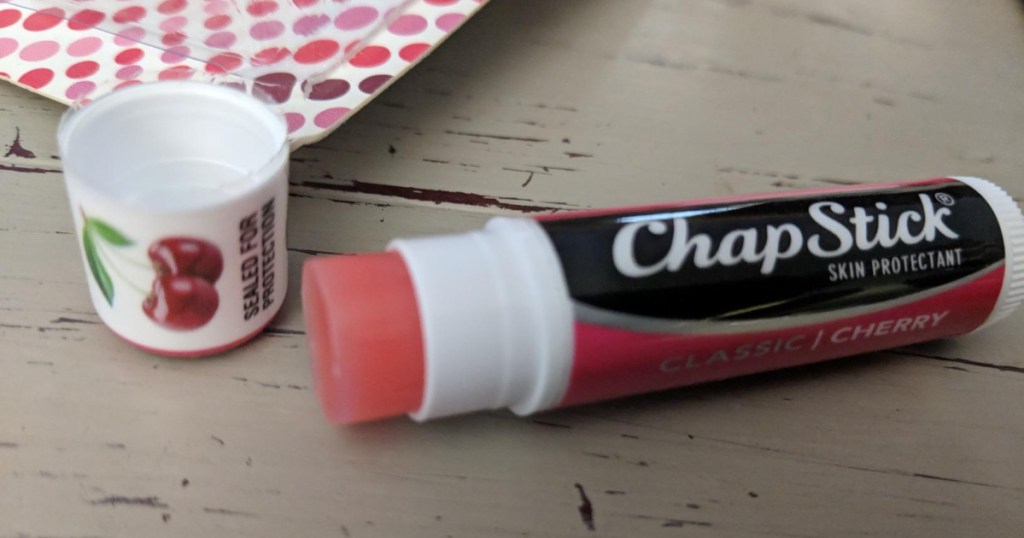 tube of cherry chapstick open on table