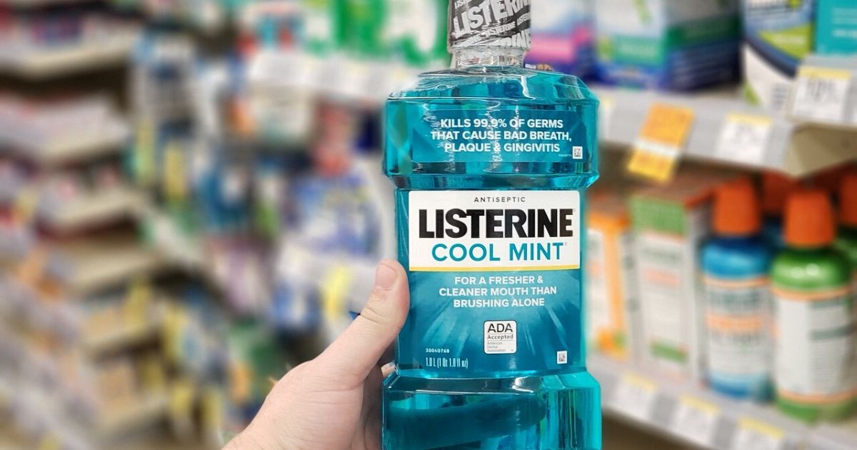 hand holding listerine cool mint mouth wash