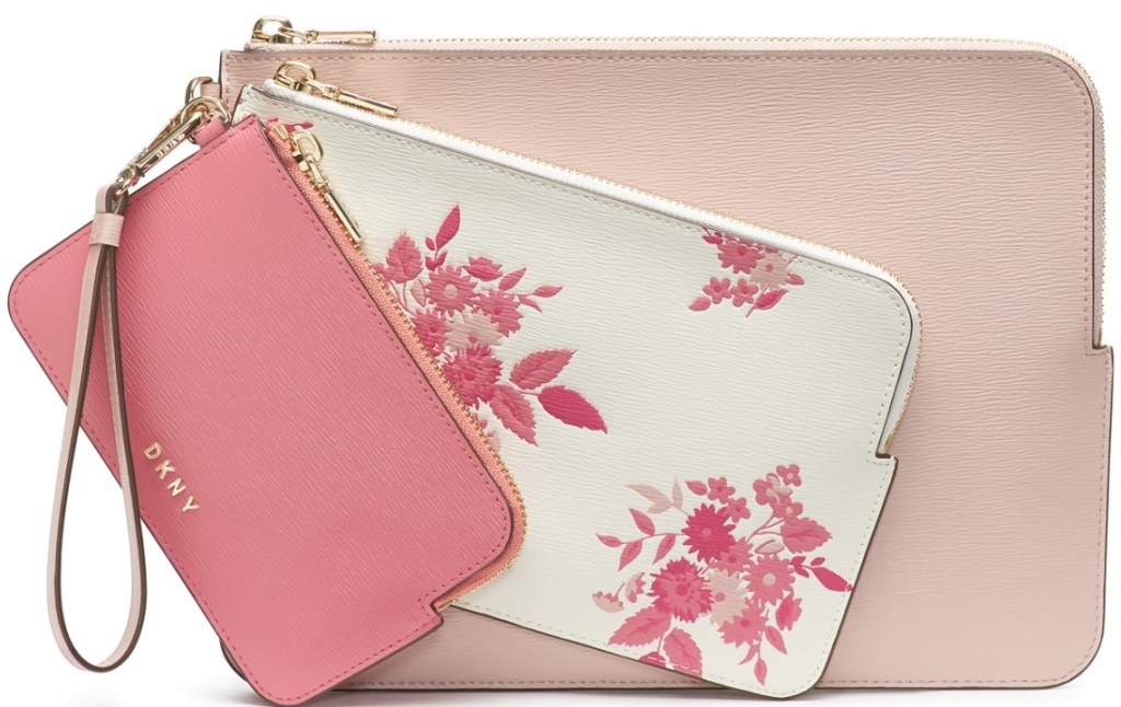 three pink and floral DKNY wristlets