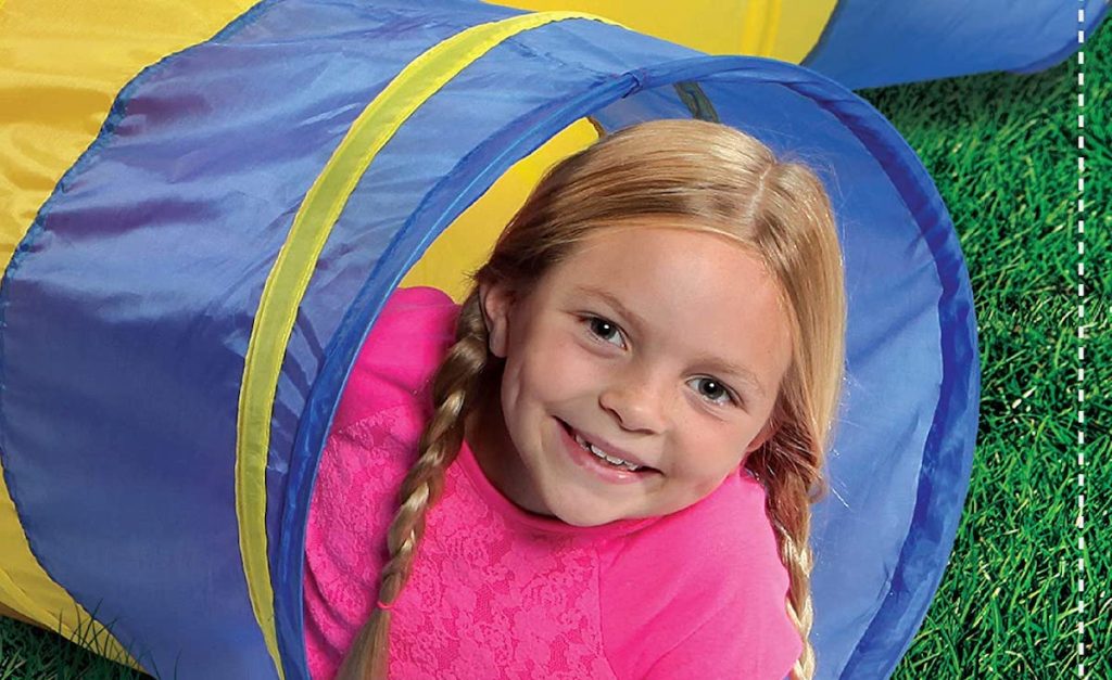 girl in a play tunnel