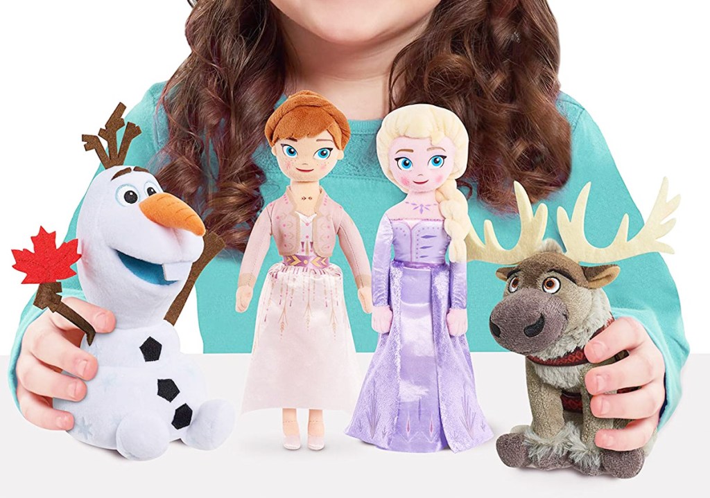 girl holding four small Disney Frozen 2 character plush