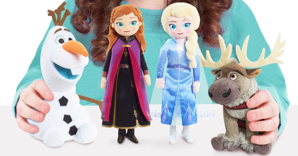 girl holding four small Disney Frozen 2 character plush