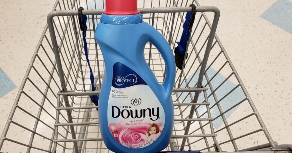 bottle of fabric softener in front of shopping cart