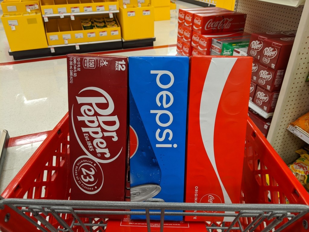 three packs of soda in a Target cart