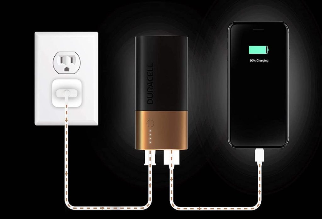 Duracell powerbank connected to an outlet and a phone
