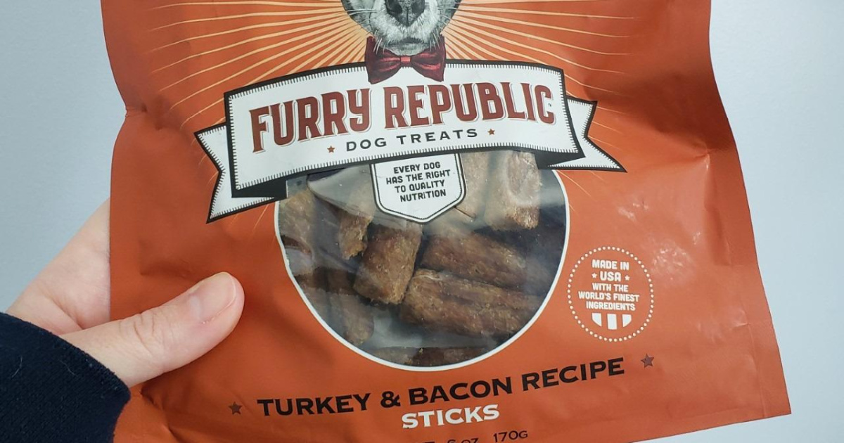 hand holdng furry republic turkey & bacon dog treats bag