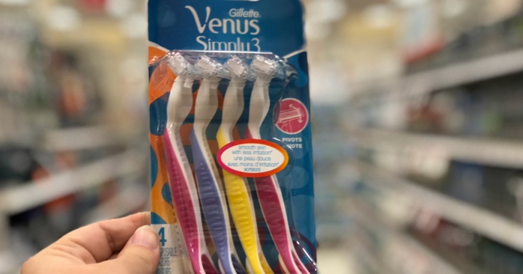 hand holding a pack of Gillette Venus Simply 3 razors