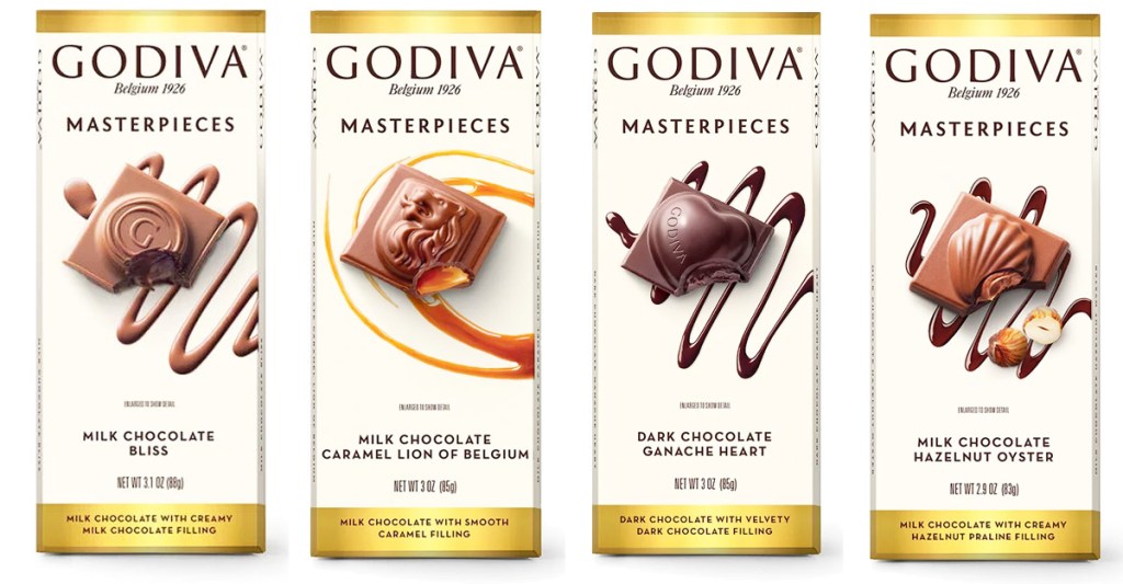 four white and gold colored bars of Godiva Masterpieces chocolate bars in various flavors