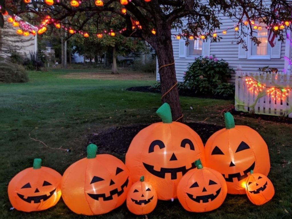 inflatable pumpkin family on front lawn