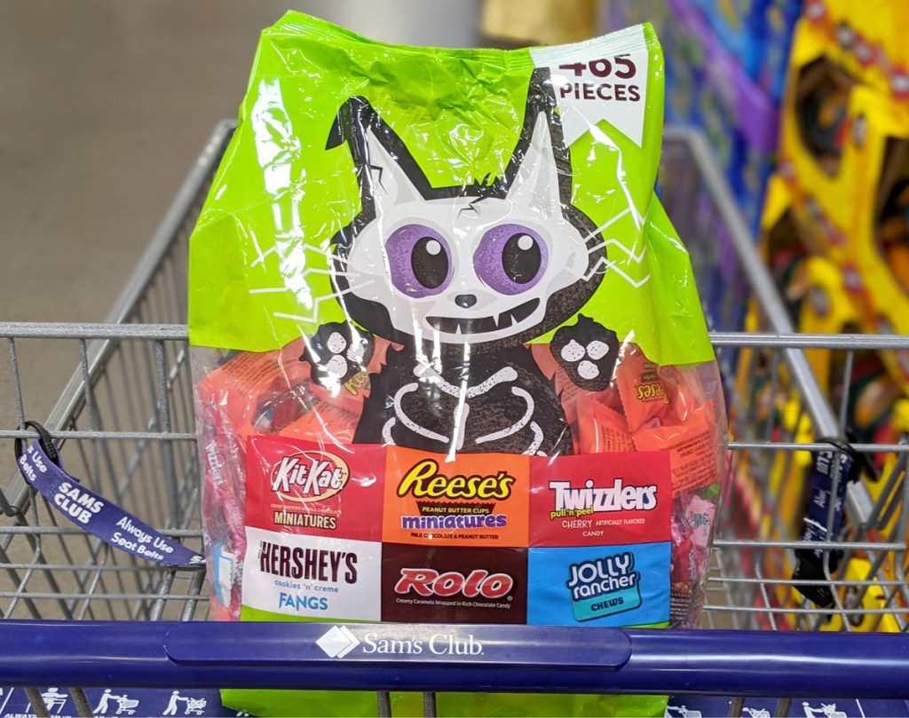 shopping cart with green bag od hershey's fun size candies
