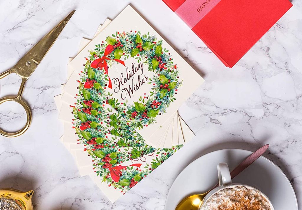 holiday cards on table with scissors