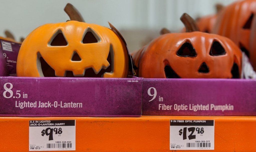 lighted pumpkin decor on store shelf