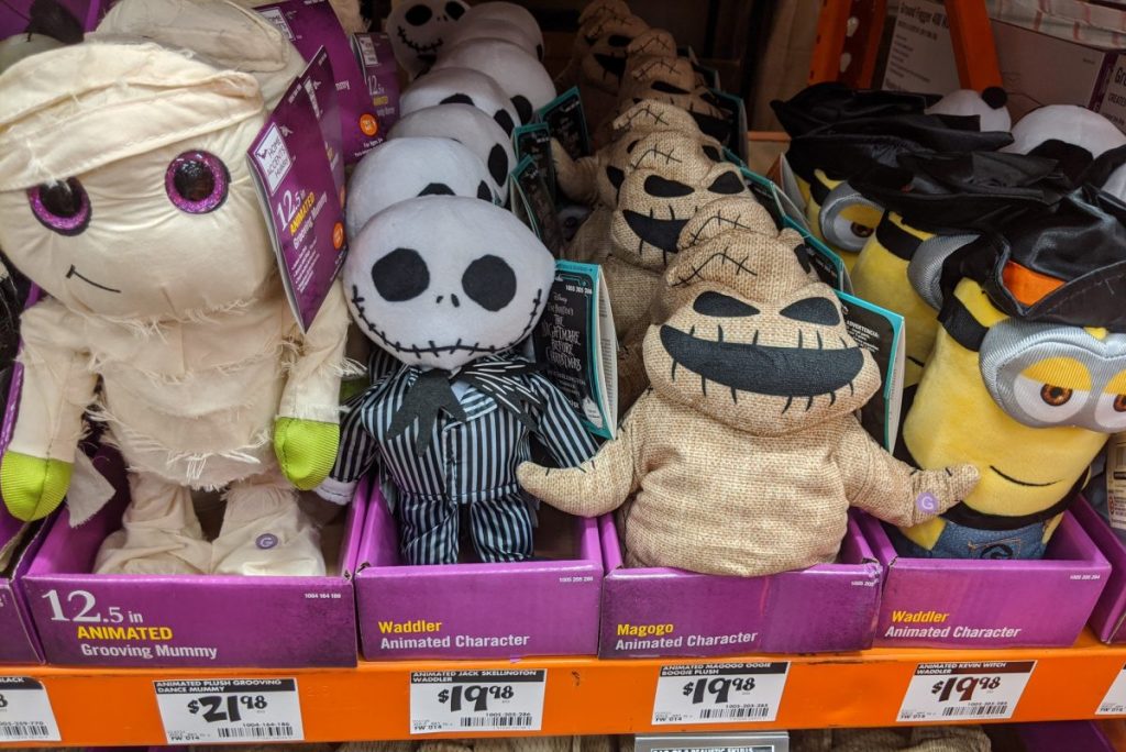 animated plush characters on store shelf