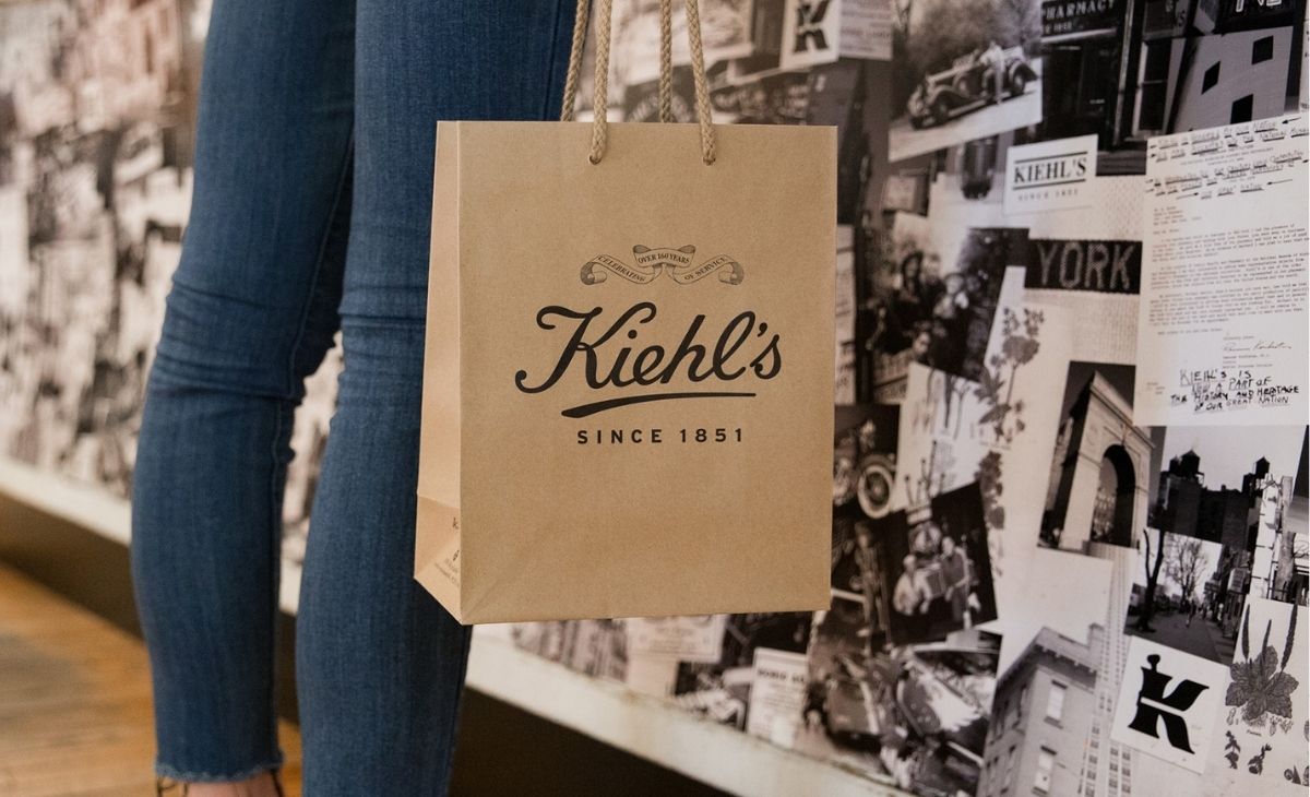 Someone holding a Kiehl's shopping bag