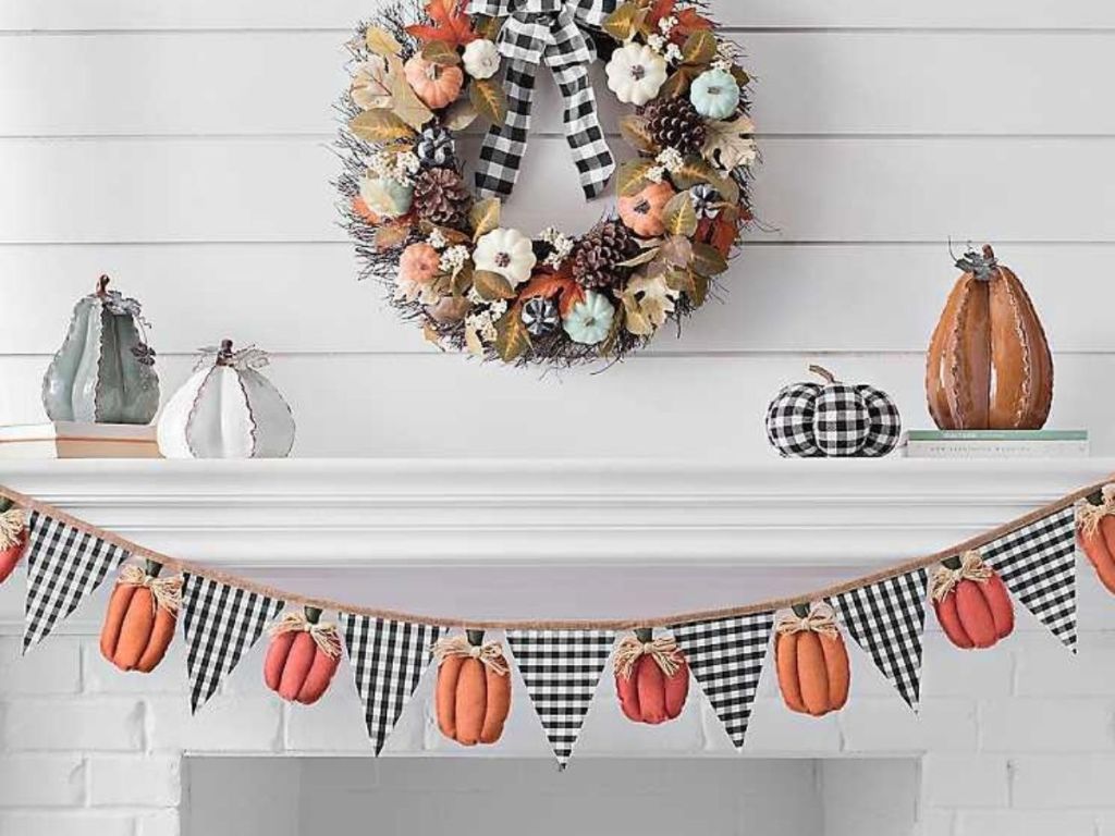 Pumpkin Banner hanging on mantle under wreath