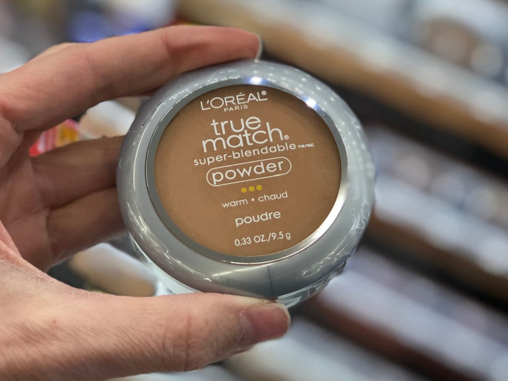 Hand holding L'Oreal True Match Face Powder