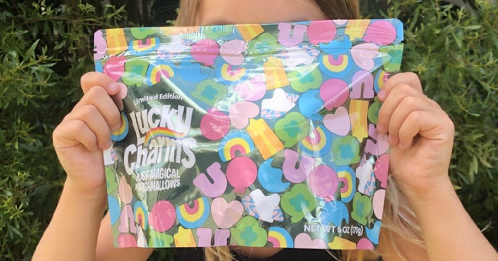 girl holding Lucky Charms marshmallows