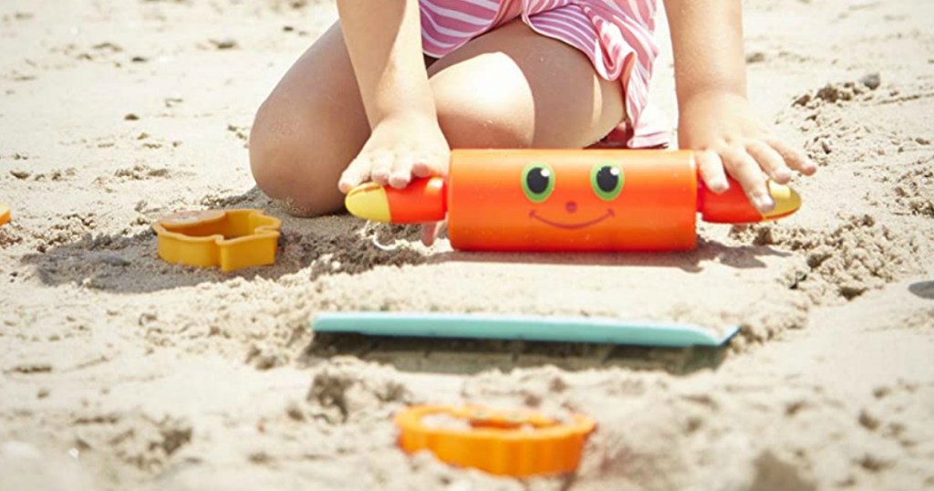 girl playing with sand toys
