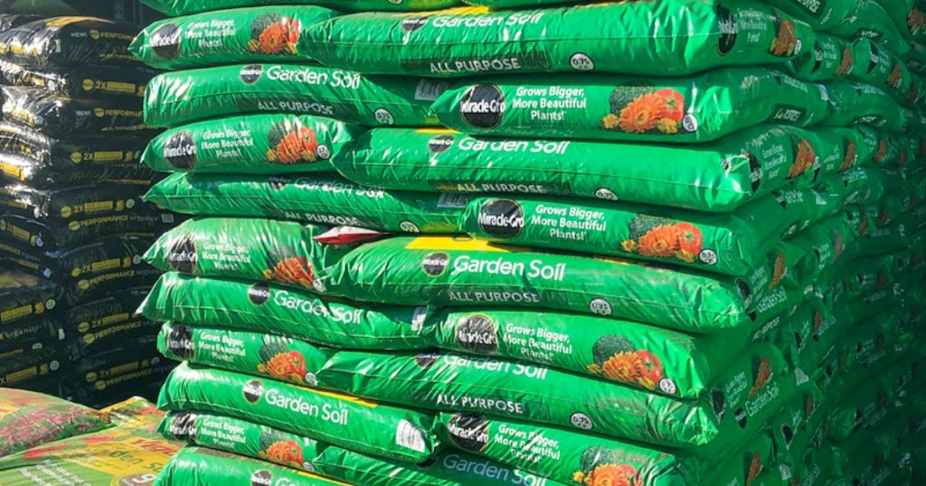 green bags of Miracle-Gro garden soil stacked on top of each other at Home Depot