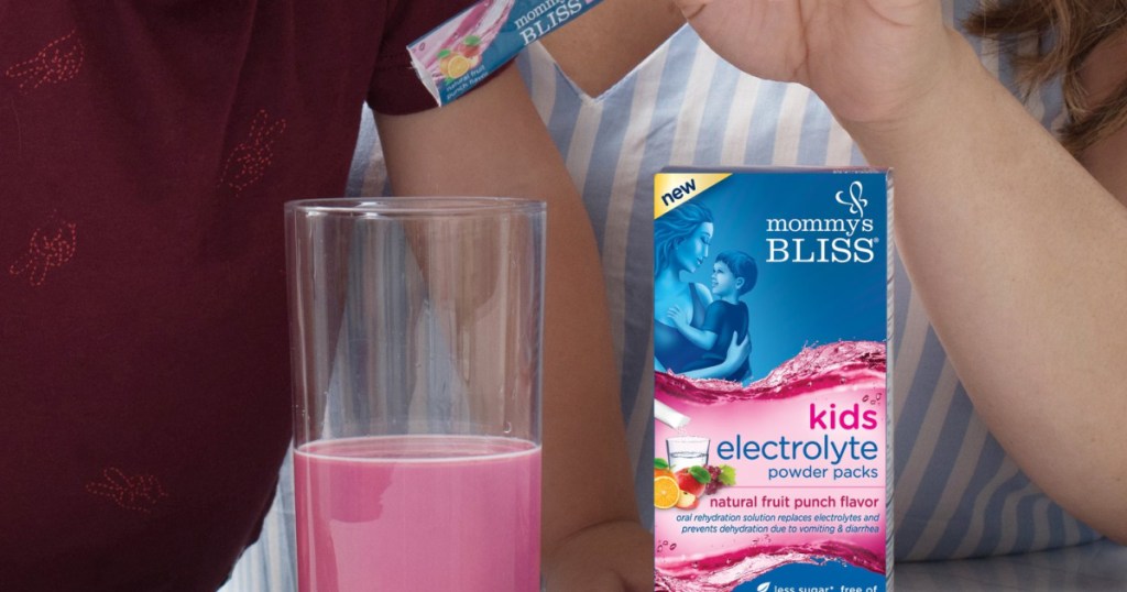 child and woman, box of electrolyte powder packs, and glass of pink liquid