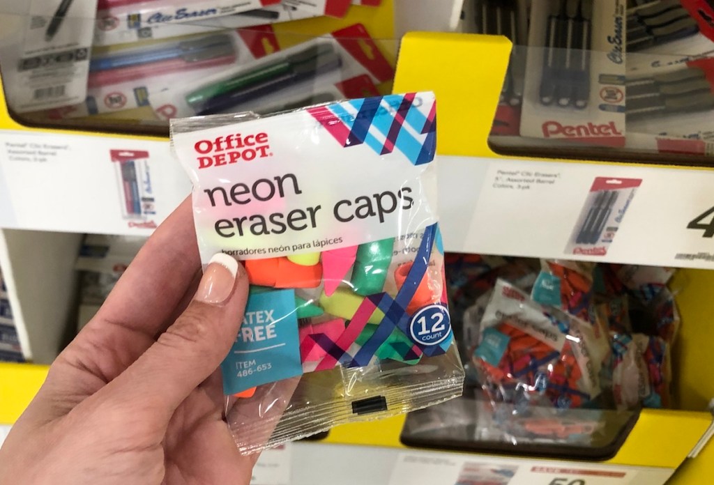 hand holding pack of Office Depot Erasers