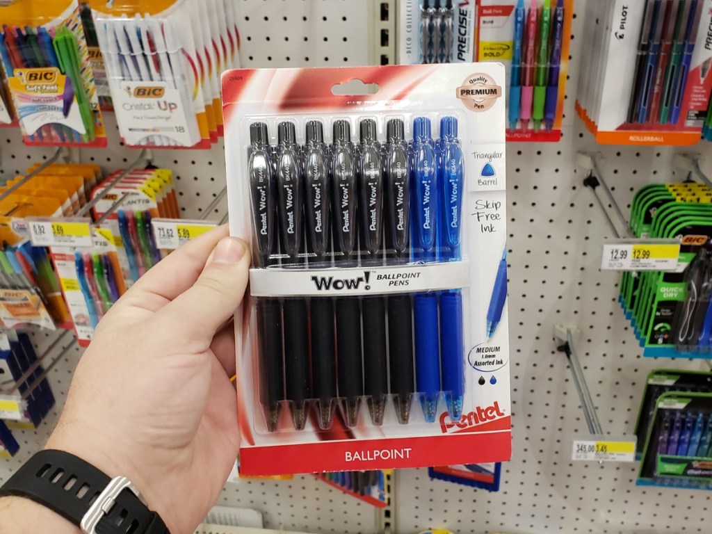 hand holding a 8 pack of pentel pens in-store