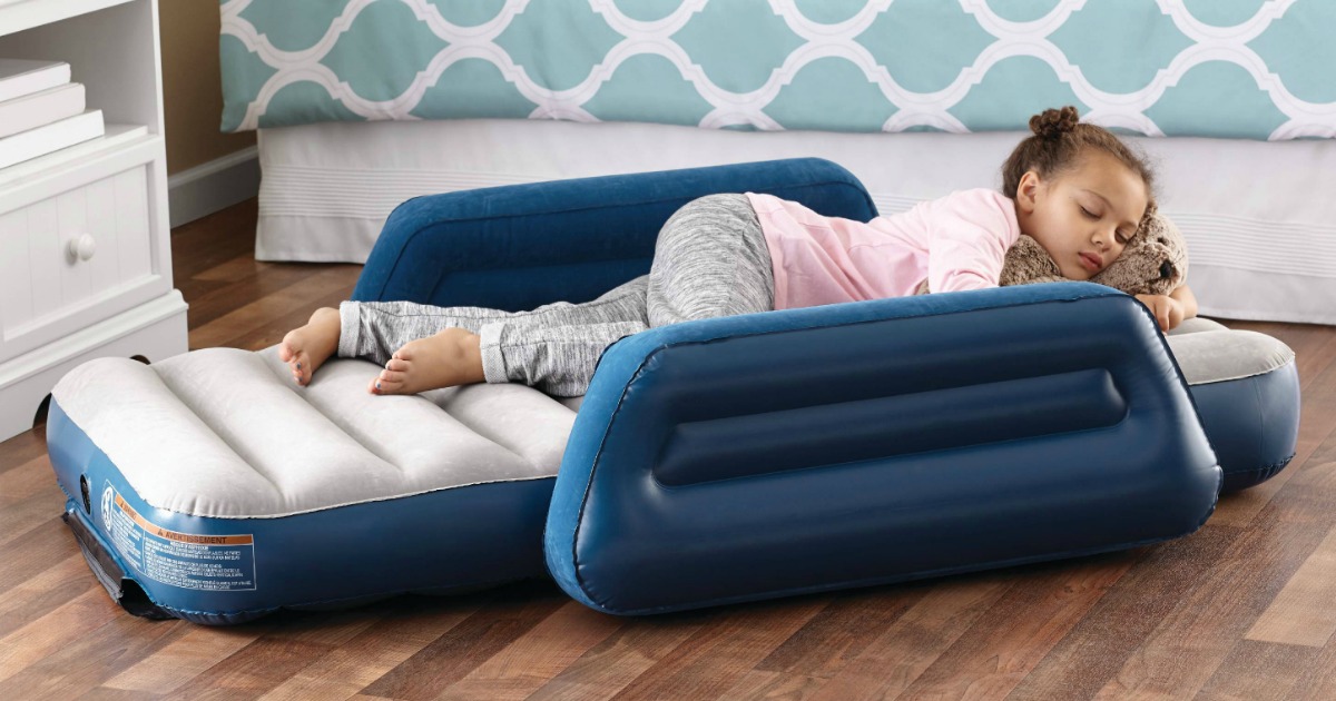 Young girl sleeping on an inflatable mattress