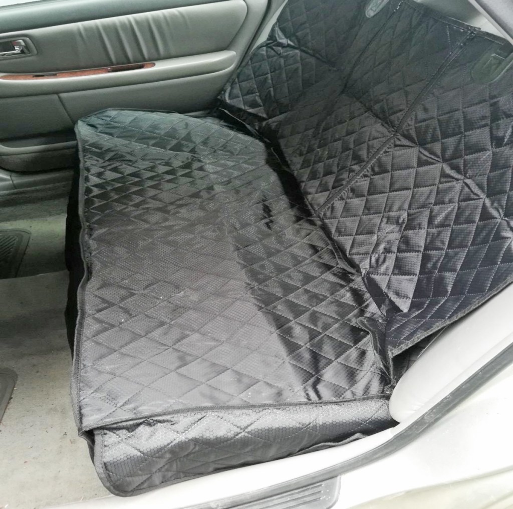 black quilted car cover on backseat of a car