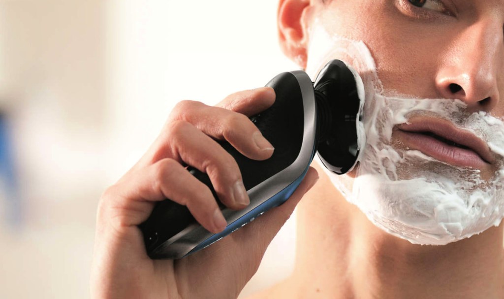 man shaving with a Philips Norelco S8950