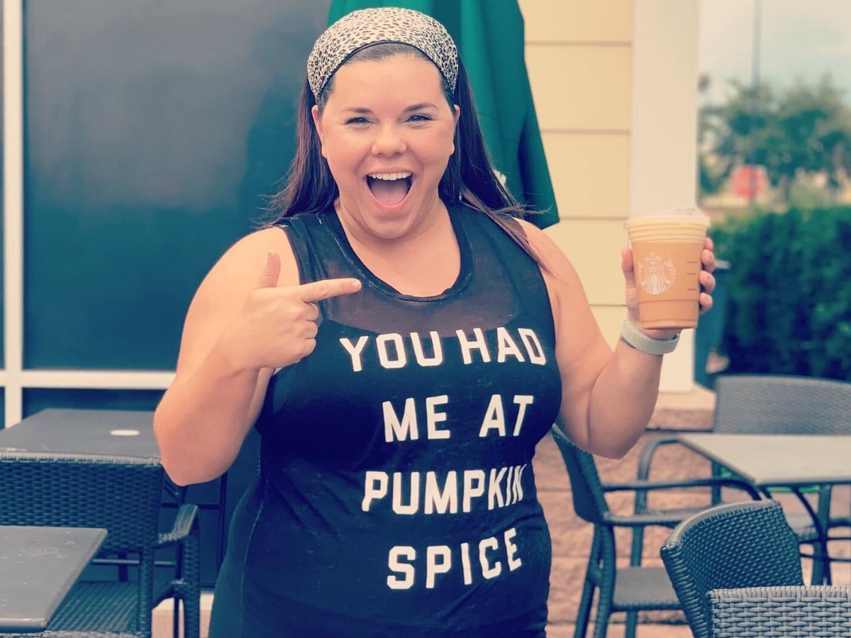 woman wearing pumpkin spice shirt