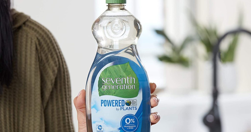 hand holding Seventh Generation Free & Clear Dish Liquid Soap