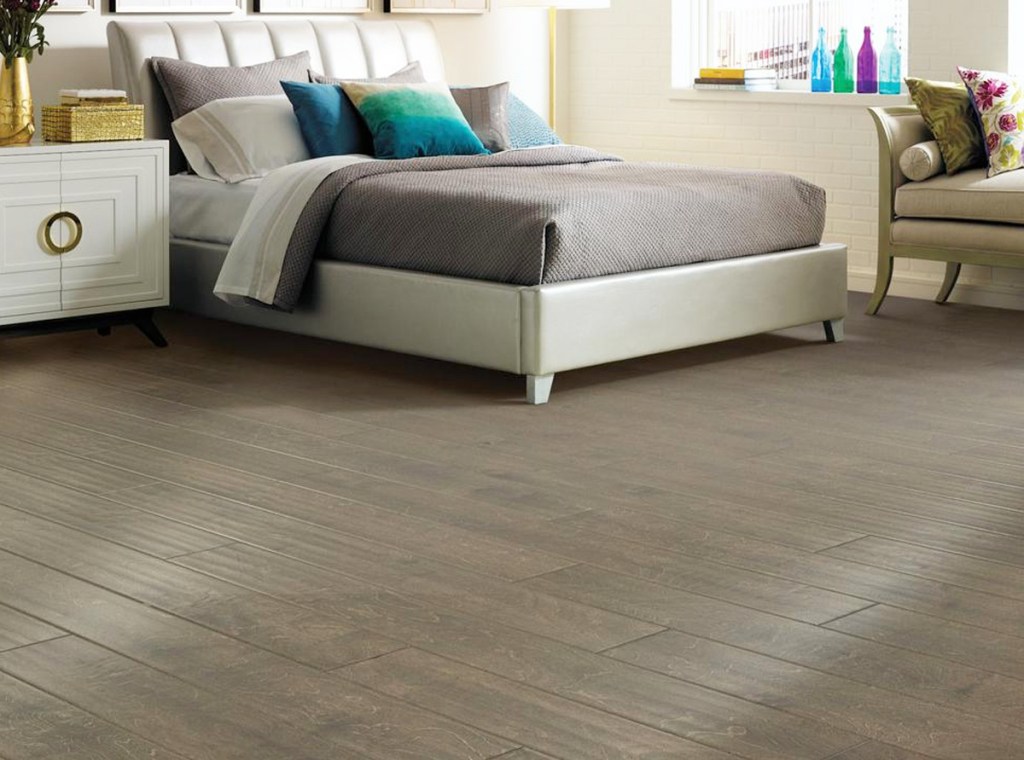 brown hardwood flooring in bedroom