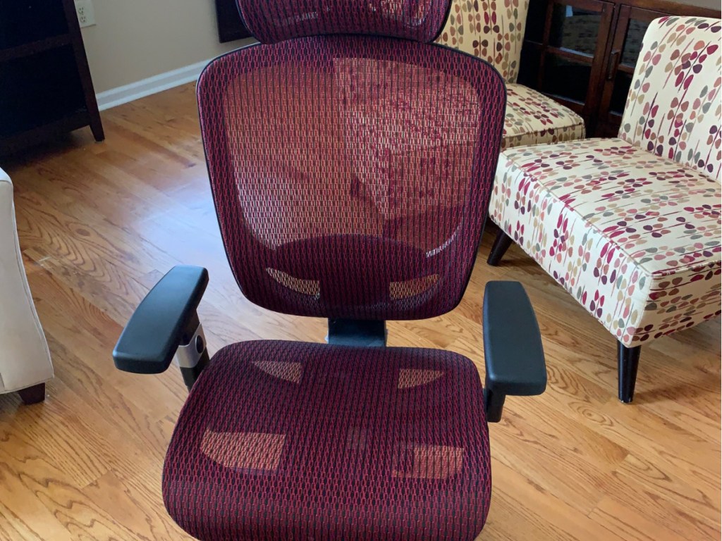 red and black mesh computer chair in home