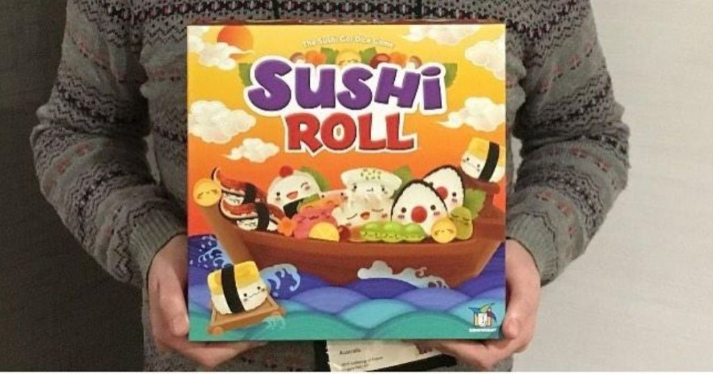 Man holding Sushi Roll Dice Game