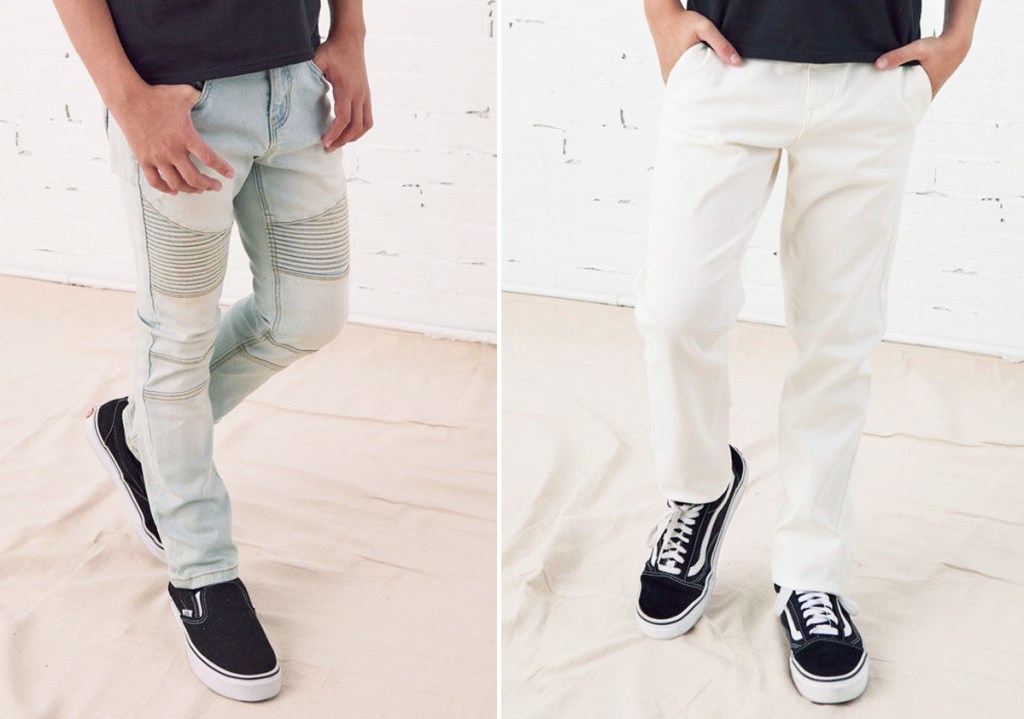two boys modeling a pair of light wash skinny jeans and white chino pants