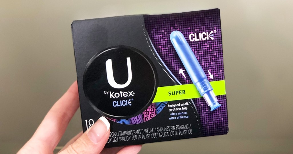 woman's hand holding a black box of U by Kotex super tampons